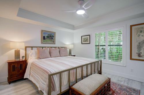 a bedroom with a large bed and a window at Le Malo Vacation Rental in Naples