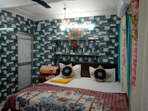 a bedroom with a bed in a room with tiles at Luv Kush Homestay Ayodhya call now- 75659-24844 in Ayodhya