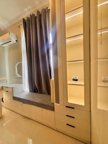 a dressing room with a window and a curtain at Phú Quốc STAR hotel in Phú Quốc