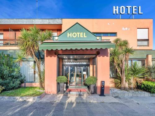 a hotel with a sign on the front of it at B&B HOTEL Eurorest Conegliano in Conegliano