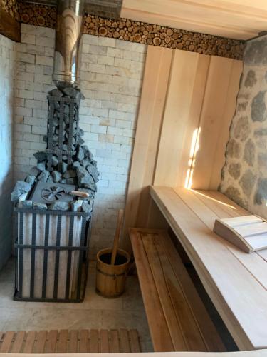 a room with a wood stove with a book on it at B&B LUCHICHI in Igalo