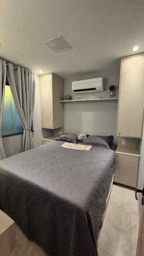 a bedroom with a large bed in a room at Apt 18 - VR Village in São Luís