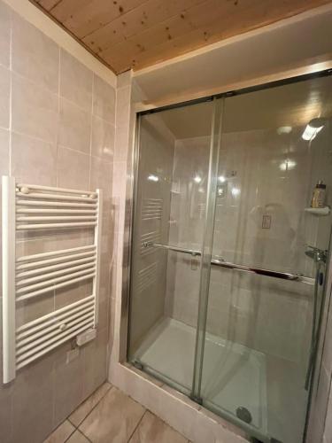 a shower with a glass door in a bathroom at Apartment in Mostuejouls in Mostuéjouls