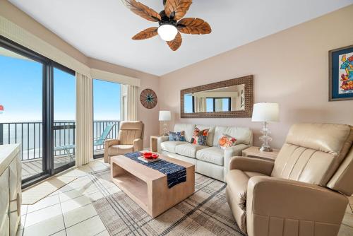a living room with a view of the ocean at Phoenix 6 Unit 1209 in Orange Beach