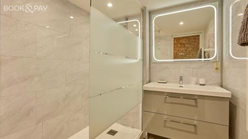 a bathroom with a sink and a mirror at Chez Moutier in Monestier