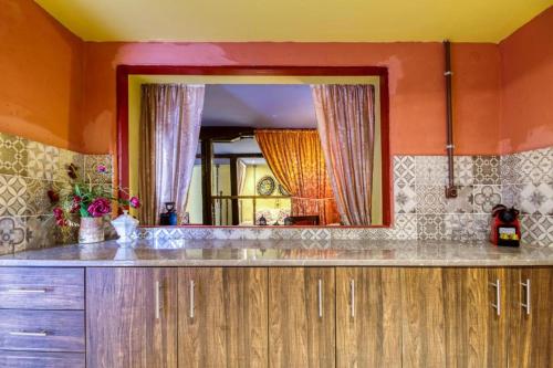 a kitchen with a large mirror and a counter at Fatma Hanoum Old Town in Rhodes Town