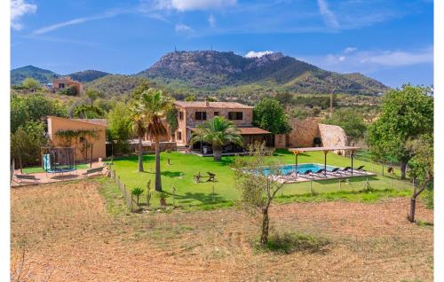 a house with a large yard with a swimming pool at Es Sequer in Felanitx