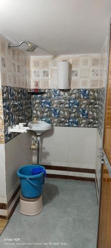 a bathroom with a toilet and a sink at ANAND LOK VARANASI in Varanasi