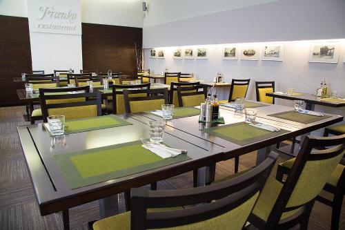 a dining room with a long table and chairs at Franko hotel in Zvolen