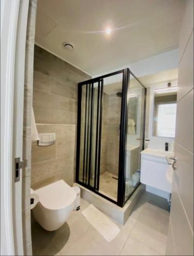 a bathroom with a toilet and a sink at CityNest Hotel Apartment in Cape Town