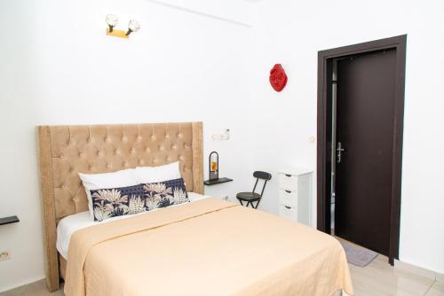 Postel nebo postele na pokoji v ubytování Fola Home