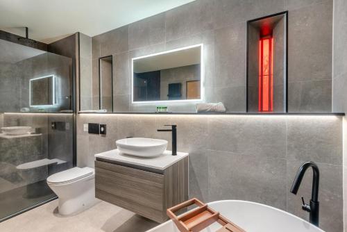 a bathroom with a sink and a toilet and a mirror at 3 Bed in Brampton oc-p34636 in Brampton