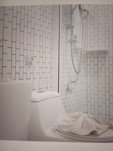 a bathroom with a shower and a plate on a counter at Star light hotel in Monterrey