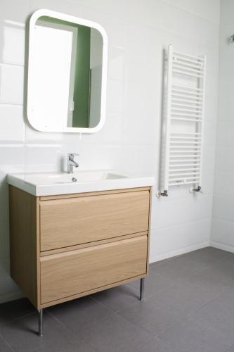 a bathroom with a sink and a mirror at Matute Street, Private rooms in Madrid