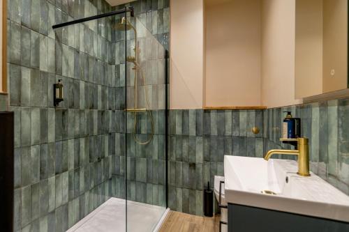 a bathroom with a shower and a sink at Brewhouse & Kitchen - Bournemouth - Southbourne in Bournemouth