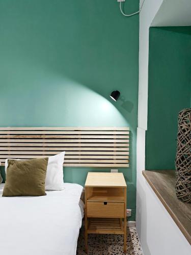 a small bedroom with a bed and a table at Cosy room 4 in Pieta