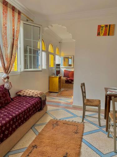 a living room with a couch and a table at Ahmed mirleft in Sidi Ifni
