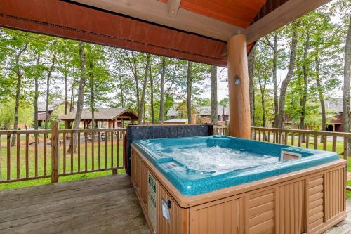 a hot tub on the deck of a house at WISPer by Railey Vacations in McHenry