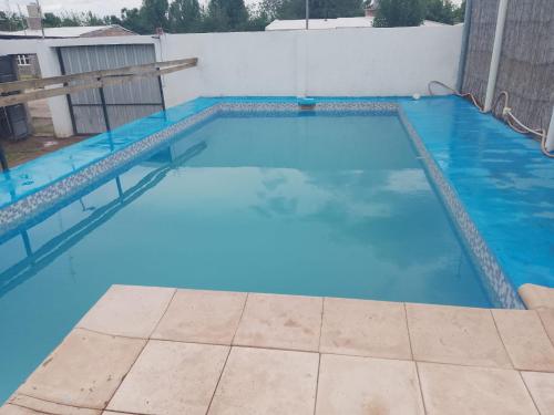 a large blue swimming pool on top of a building at Elu in Ingeniero Giagnoni