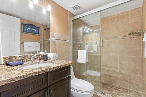 a bathroom with a shower and a toilet and a sink at Daytona Harbour Beach Resort Unit 808 in Daytona Beach