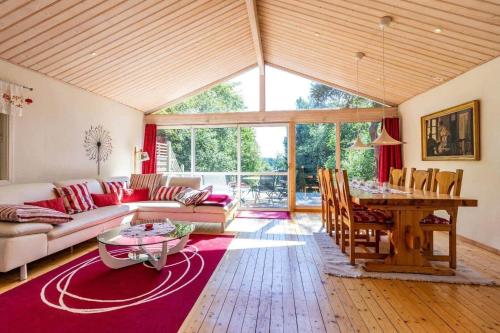 a living room with a couch and a table at HAL819-Unnaryd-Soedra-vaegen-29-b in Unnaryd