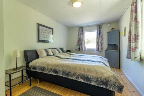 a bedroom with a bed and a window at HAL819-Unnaryd-Soedra-vaegen-29-b in Unnaryd