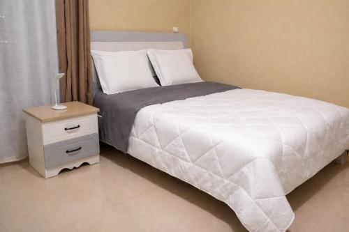 Llit o llits en una habitació de Milestone Villa