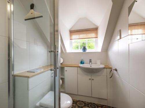 a bathroom with a shower and a toilet and a sink at 2 Bed in Kelling Holt oc-76755 in Kelling