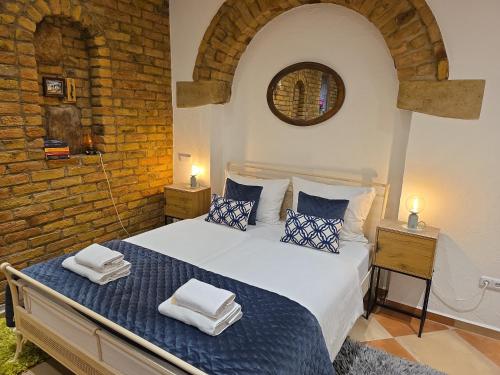 a bedroom with a bed with towels on it at Altstadt Speyer in Speyer