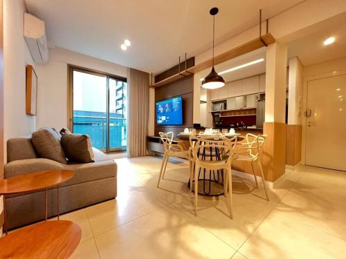 a living room with a couch and a table at LK Savassi 7 in Belo Horizonte