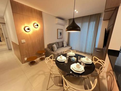 a living room with a table and a couch at LK Savassi 7 in Belo Horizonte