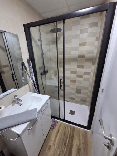 a bathroom with a shower and a sink at Las vegas in Alcorcón