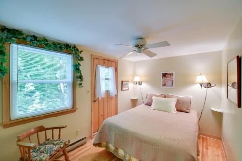 a bedroom with a bed and a window at The Carriage House Walk to Peninsula State Park in Ephraim