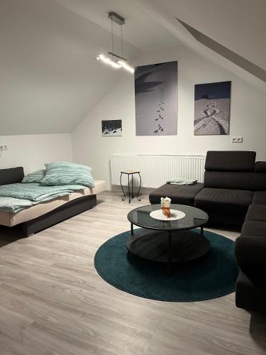 a living room with a couch and a coffee table at FeWo HansUndChrista in Mariapfarr