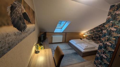 a small room with a bed and a window at FitnessFun in Krzyż