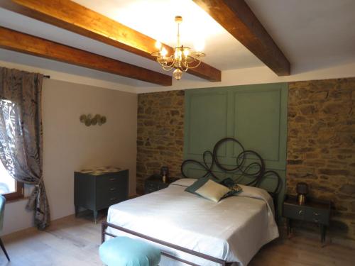 a bedroom with a bed and a ceiling at Casale Santa Margherita in Bucine