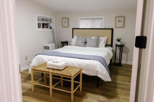 a bedroom with a large bed and a table at Seabiscuit Loft - Studio in Downtown Lexington in Lexington
