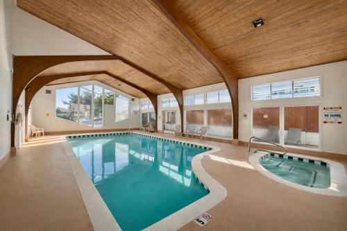 an indoor swimming pool with a large ceiling at Stargazer Hotel in Monterey