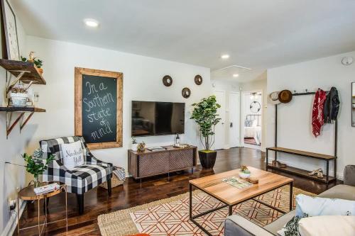 a living room with a chalkboard on the wall at The Southern State of Mind by Stay Local Nashville in Nashville