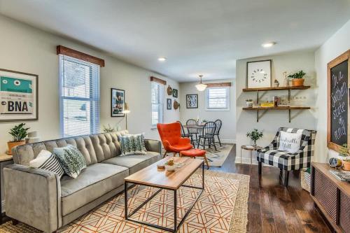 a living room with a couch and a table at The Southern State of Mind by Stay Local Nashville in Nashville