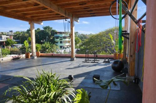 a gym with a view of a building at Casa Toro La Punta in Puerto Escondido