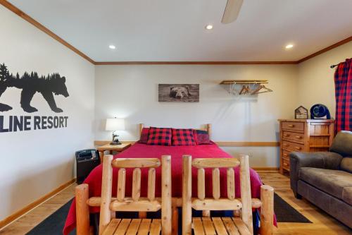 a bedroom with a bed with two chairs and a couch at Pet Friendly! Couples Retreat in Southern Illinois in Etherton