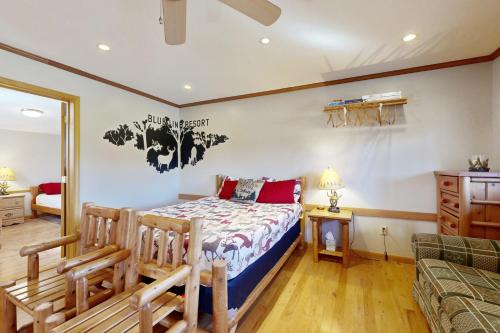 a bedroom with a bed and a couch at Cabin 2: Lakeside in Murphysboro in Etherton
