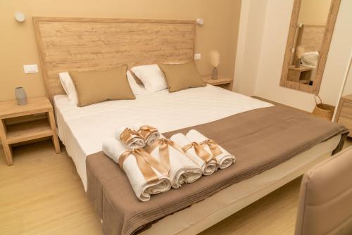 a bedroom with a large bed with towels on it at B&B Conero Hermitage in Marcelli