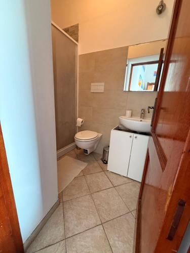 a bathroom with a toilet and a sink at Maison Raphael Positano in Positano