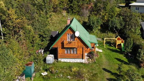 an aerial view of a wooden house on a hill at Chata Retro in Tatranská Lomnica