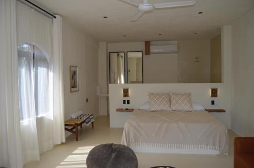 Llit o llits en una habitació de Hotel Men Zipolite