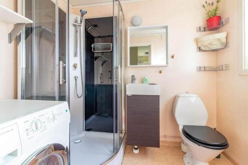a bathroom with a toilet and a glass shower at KRO863-Virestad-Stubbalycke-4 in Virestad