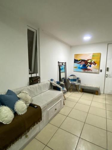 a room with a couch and a painting on the wall at Arena Marina-Sol l in El Cerrillo