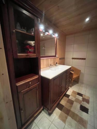 a bathroom with a sink and a medicine cabinet at The View - Mountain cabin with stunning views in Stranda